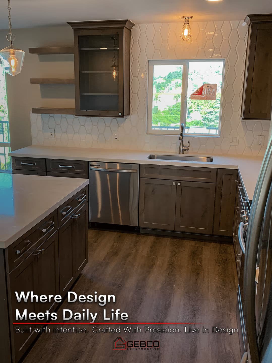 Modern kitchen design featuring sleek cabinetry, quartz countertops, and scenic window view.