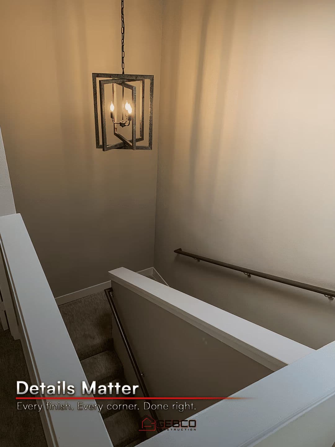 Modern staircase with elegant lighting showcasing attention to detail in home design.